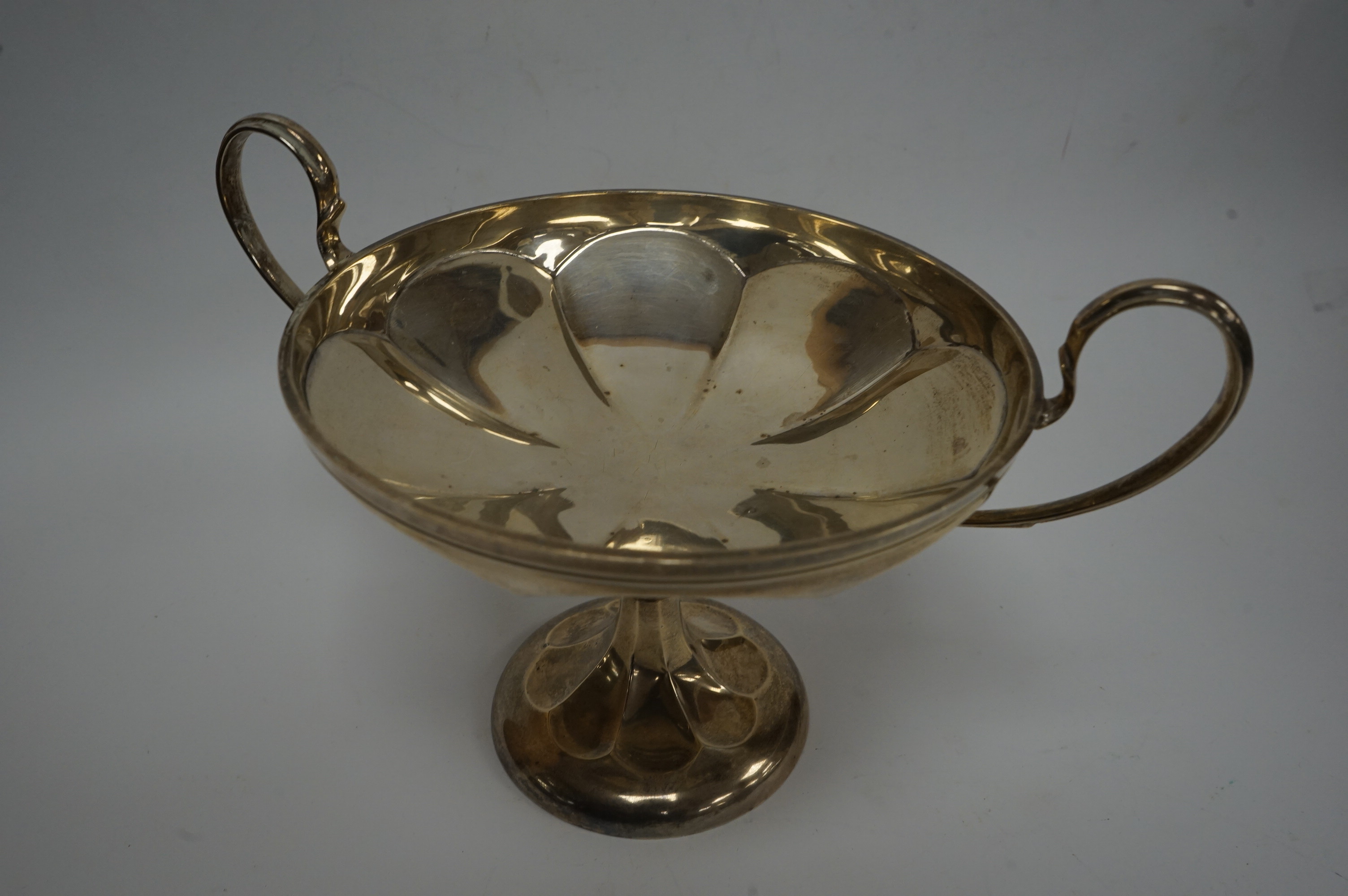 A George V silver two handled tazze, by Elkington & Co, Birmingham, 1919, height 16.7cm, 11.9oz. Condition - poor to fair